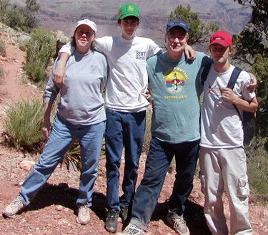 Pat, her husband David, and their two sons at a family vacation to the Grand Canyon.
