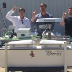 Unmanned surface vehicle with 3 of the 4 Principal Investigators