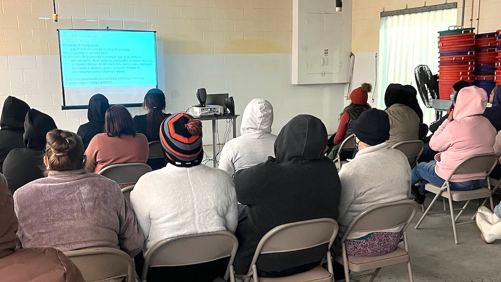 Spanish-speaking workers attend Sanitation and safety training at Pamlico Packing Company.